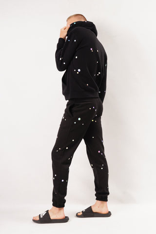 Unisex Joggers von Starstyling mit handplatzierten holografischen Dots; wahlweise Straight oder Wide Leg – reflektierende Akzente für Street, Event und Bühne.
