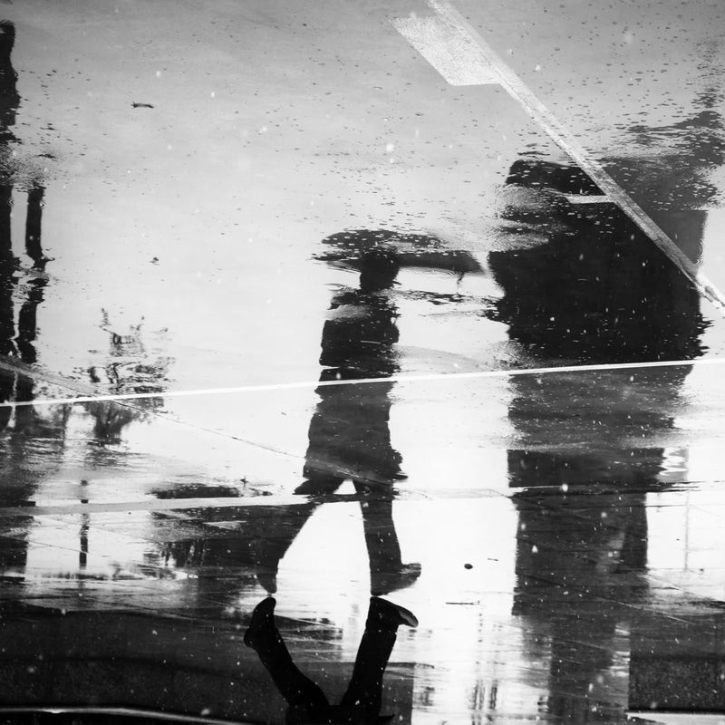 Man's reflection on a wet street Poster - Black and White Photography — Ansicht 3