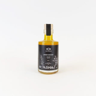 Flasche des premium wood elixir 200ml – veganes, natürliches Holzöl mit Carnaubawachs zur Pflege und zum Schutz von Holzoberflächen