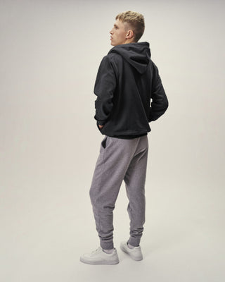 Herren Sweatpants in Grau Melange, Rückenansicht getragen