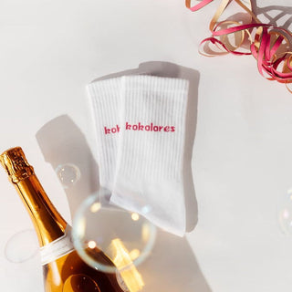 Kokolores Statementsocken von arrel mit Seifenblasen und Sektflasche